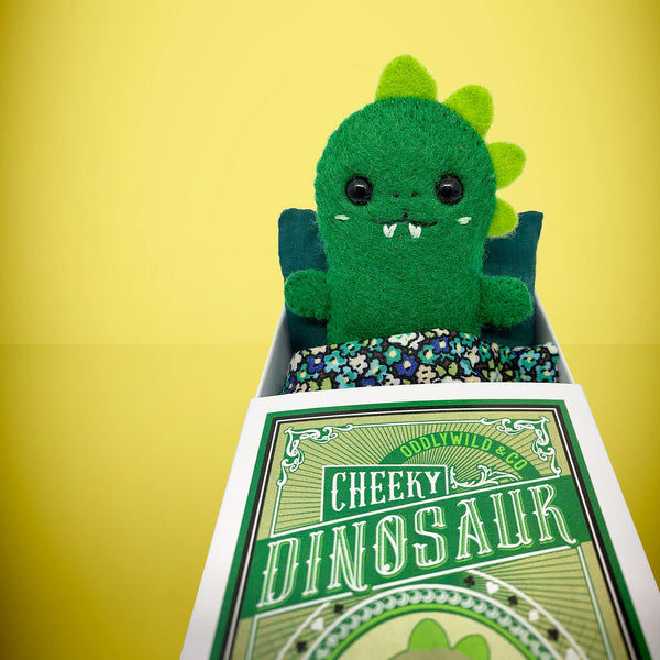 Felt dinosaur in a box