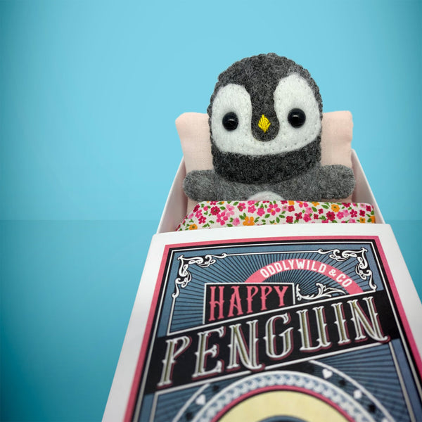 Felt penguin in a box