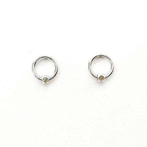 Silver circle with diamond cut nugget stud earring