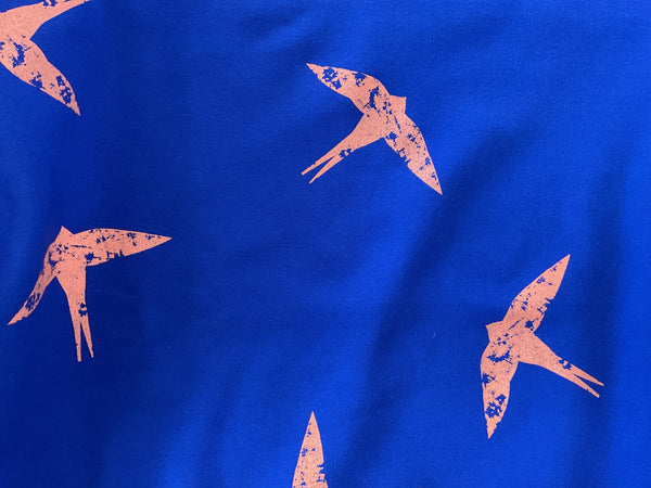 Orange Swallow design blue sweatshirt