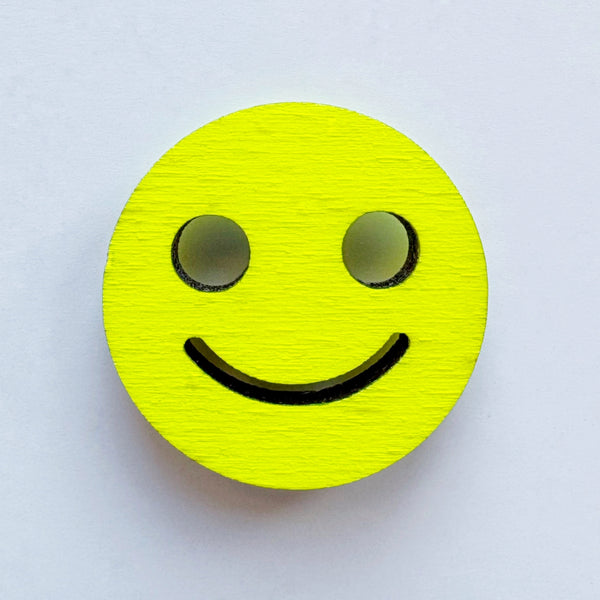 Smiley yellow pin brooch