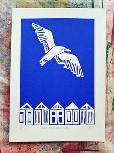 Gull Over Beach Huts A4 print