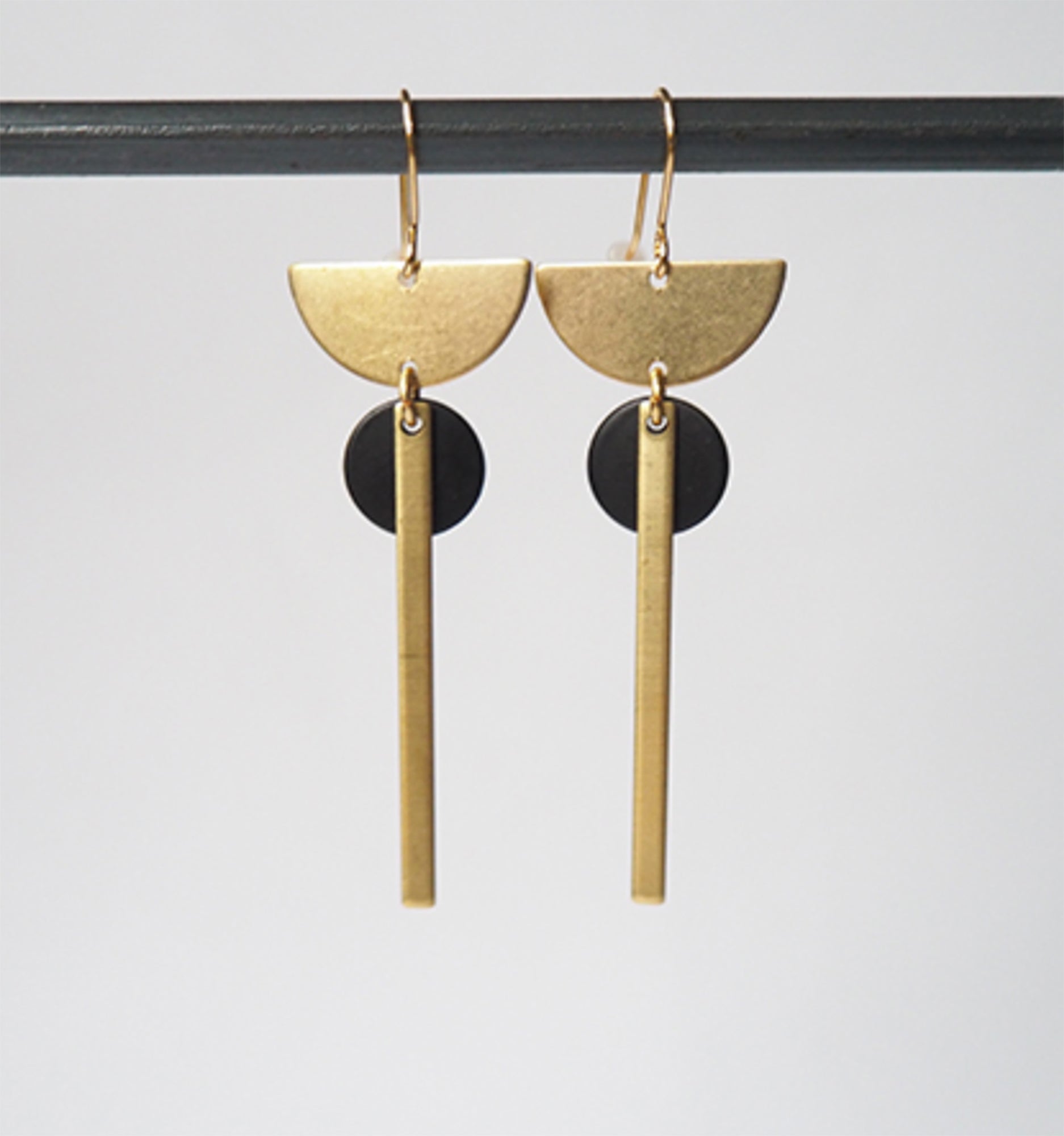 Brass crescent + bar + black disc earrings