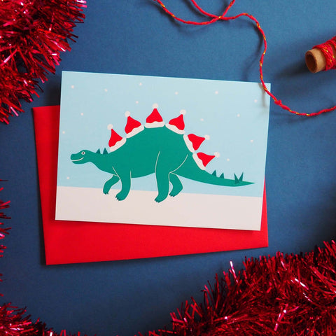 Dinosaur wearing Christmas hats card