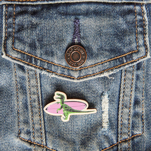 Surf's Up Suzy pin badge