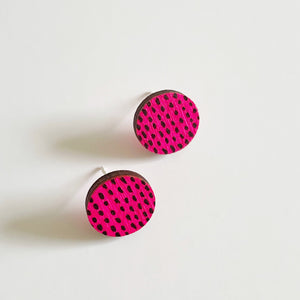 Plywood neon pink with black dash studs